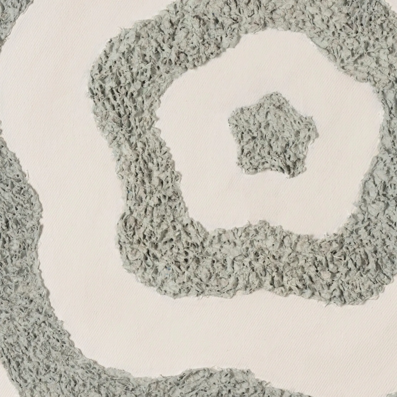 Close-up detail of raised grey textured lines on white canvas showing handmade surface texture